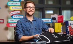 Libraries staff member with laptops for loan