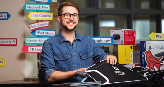 UVic Libraries team member packs laptops into cases