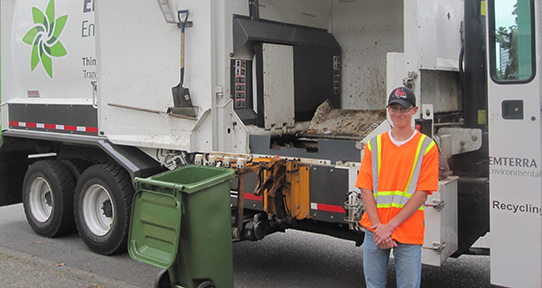 James in front of garbage truck