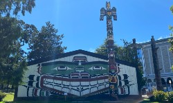 A ceremonial big house and totem pole