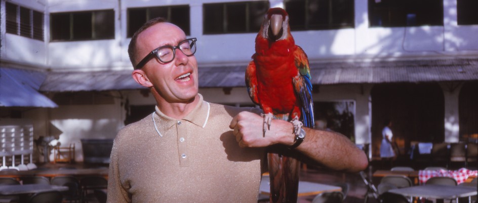 Frank Williams holding a parrot