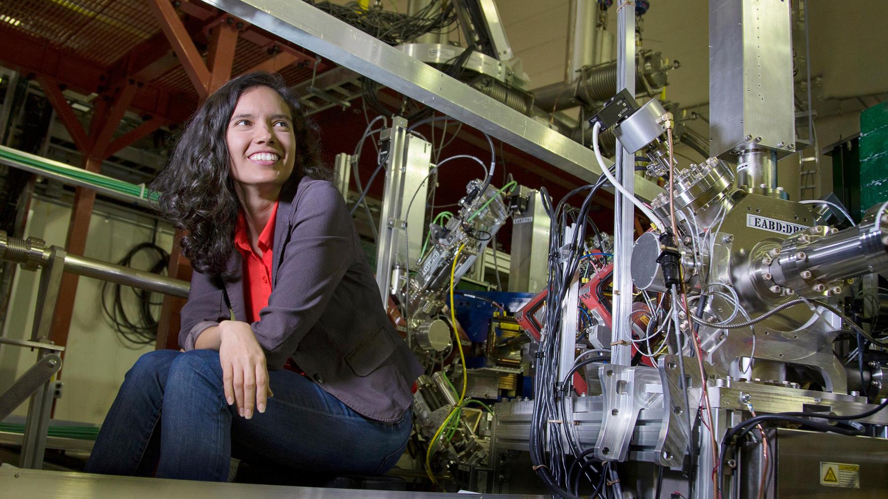 student sitting beside a machine