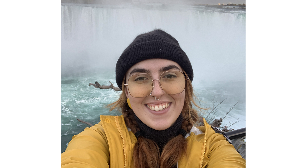 Photo of SSP scholar Lily in front of waterfall