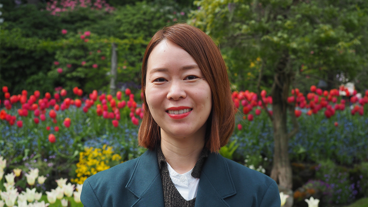 2025 scholar photo with flowers in background