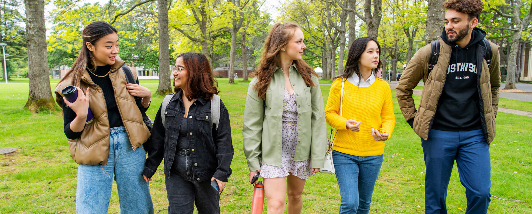 BCom students walking in the quad