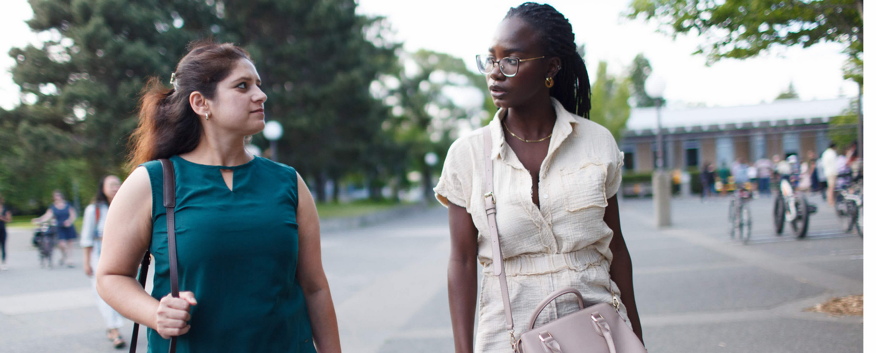 Two MBA students walking outdoors