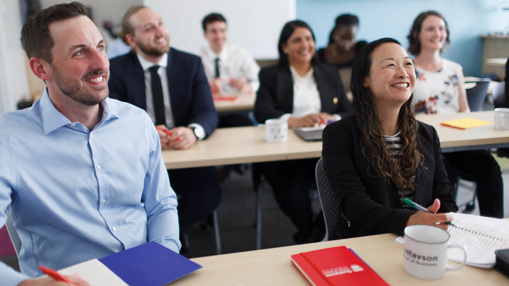 MBA class in session sitting at desks