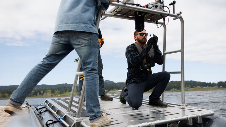 Brant Chlebowski working on a robot boat