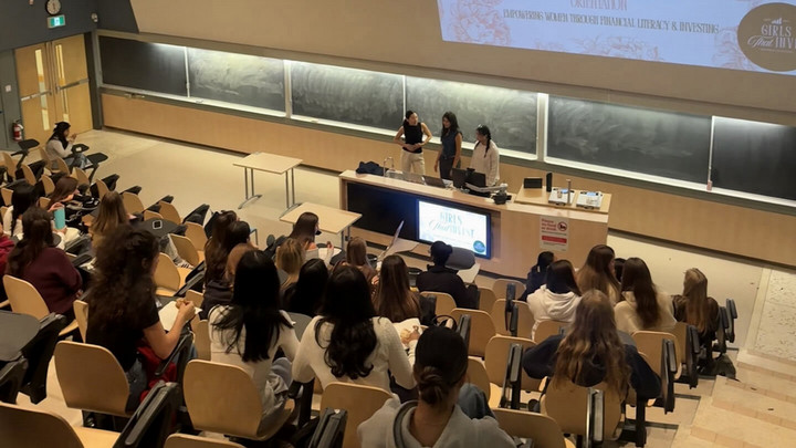The UVic Girls that Invest club presenting before an audience