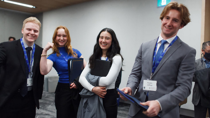 Hiroko Mahoney and her group at the RBC Case Competition with prizes in hand
