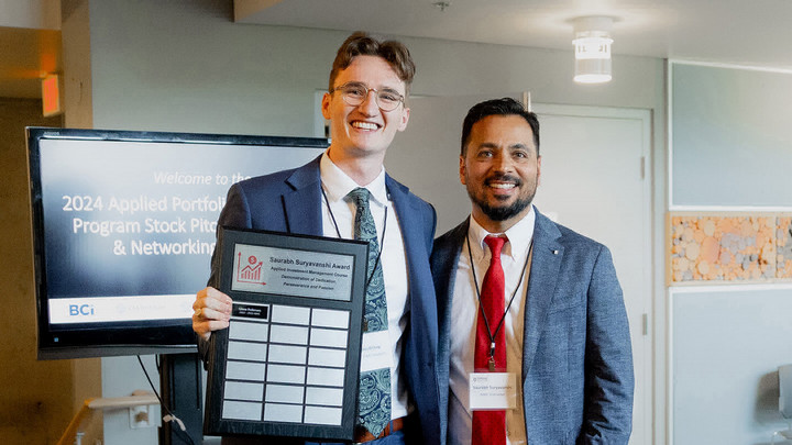 Jack DesBrisay receiving an award from Saurabh Suryavanshi