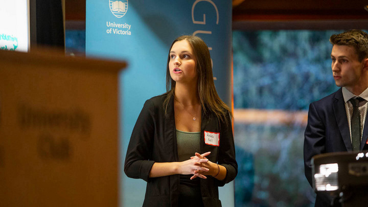 Another team member speaks during their presentation
