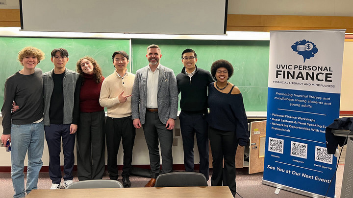 Sampras Chung and his colleagues at a UVic Personal Finance club event