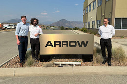Jacob Adams, Ian Schoeddert and Taylor Entz by the outdoor sign at Arrow Transportation