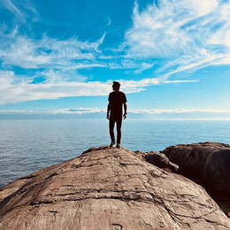 An MGB student down at the ocean