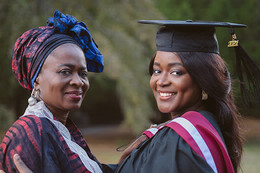 Yinka Fasheun in her graduation gown with her mom 