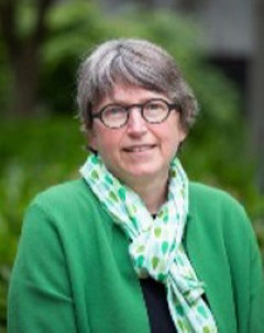 Dr. Vera Caine wearing a green sweater