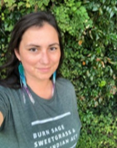 Dr. Christina Chakanyuka wearing a green t-shirt