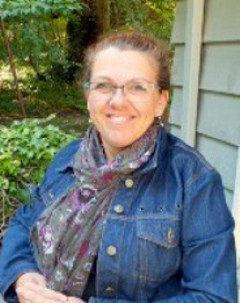Dr. Lenora Marcellus wearing a denim jacket