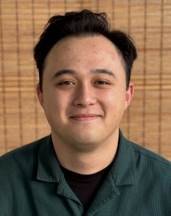 Sam Kaiser wearing a green shirt