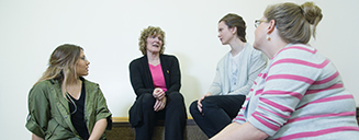 Students talking with a professor