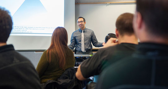 Photo of presenter during a learning and development course