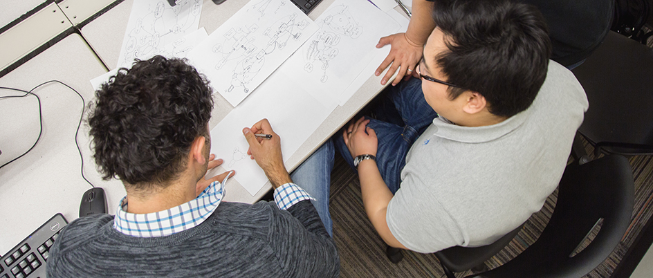 Two students working together at a desk