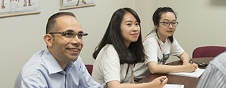 Three students in a classroom