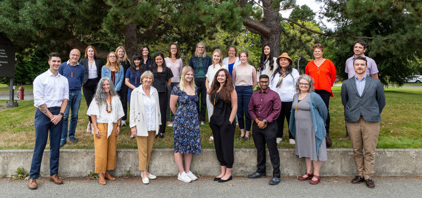 students faculty and staff picture taken outside on UVic grounds