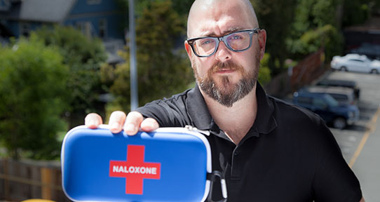 Griffin Russell displaying a Naloxone kit
