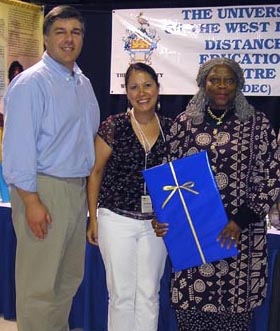 Prof. Monty Montgomery of the School of Social Work presented a gift of thanks on behalf of UVic and the Coast Salish nations to Jamaican representative Ms. Vilma McCLenan.