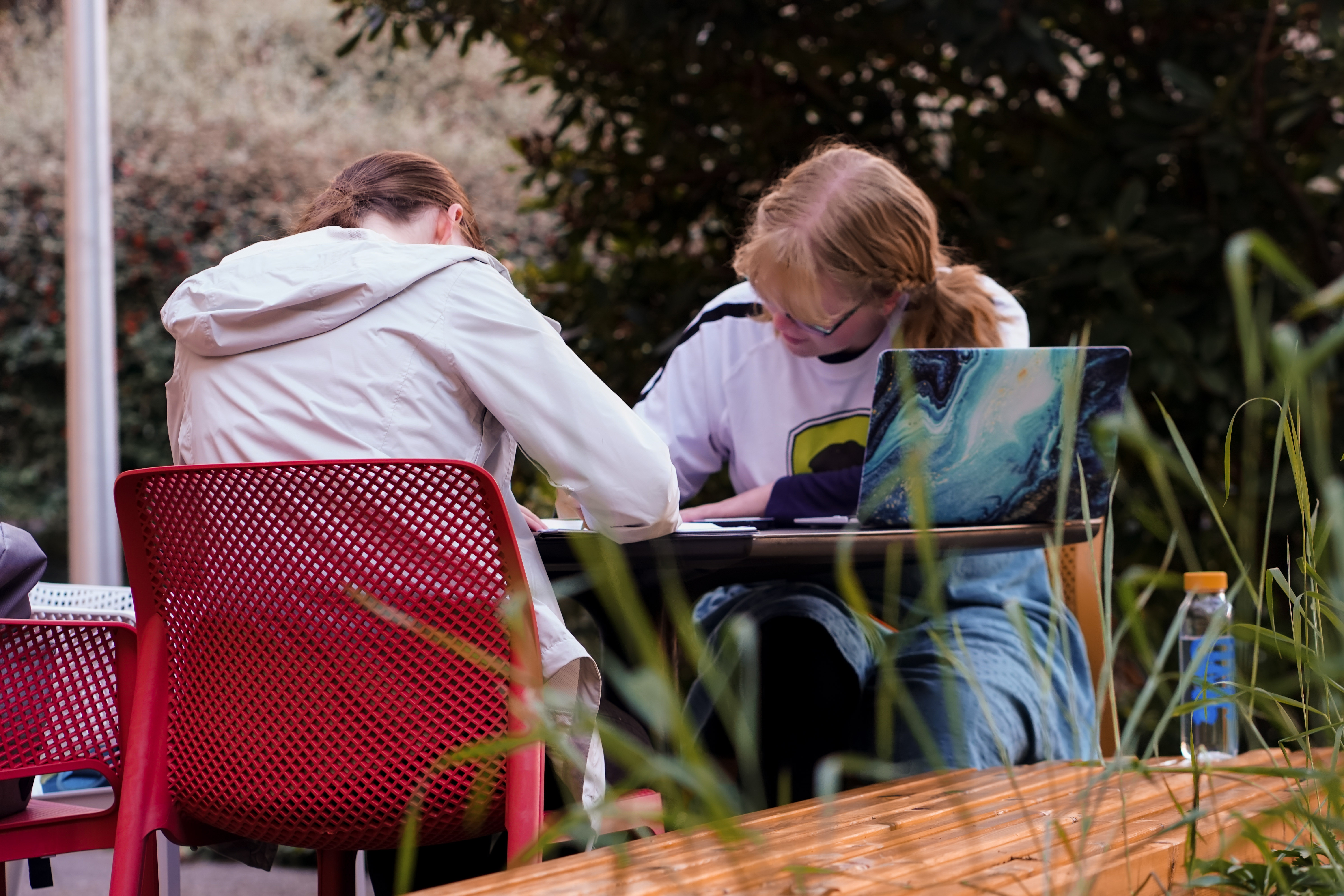 two students writing in the clearihue courtyard 2021 (Image credit: Katrianna Skulsky)
