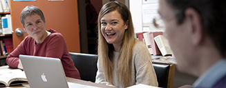 Students and faculty in a reading room