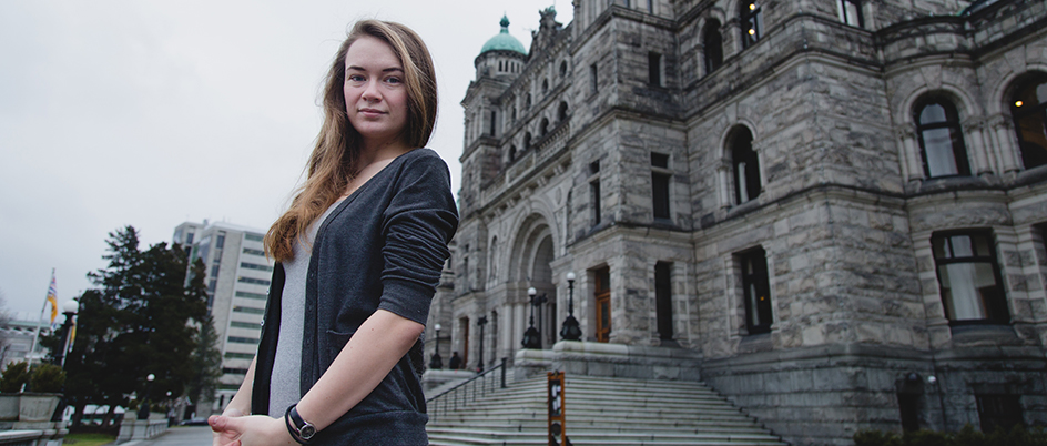 Zoé Duhaime standing in front of the BC Legislature Buildings