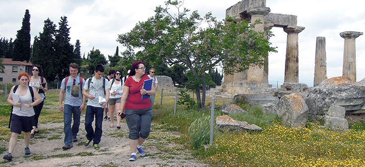 UVic students walking through Ancient Corinth