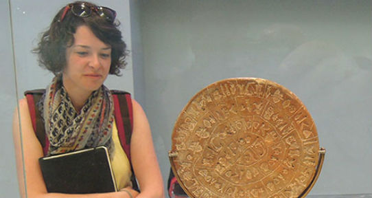 Student reading Phaistos disc