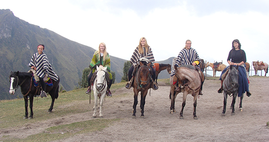 Students riding horses during an excursion in Ecuador. 