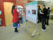 Participants viewing student research posters.