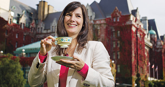 Alex D’Arcy sips tea in front of the Empress Hotel