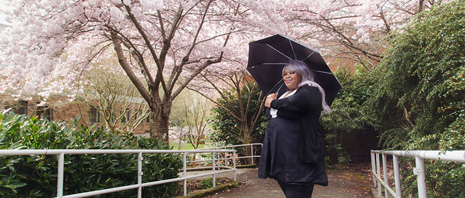 N’Donna Russell by the cherry blossom trees on campus