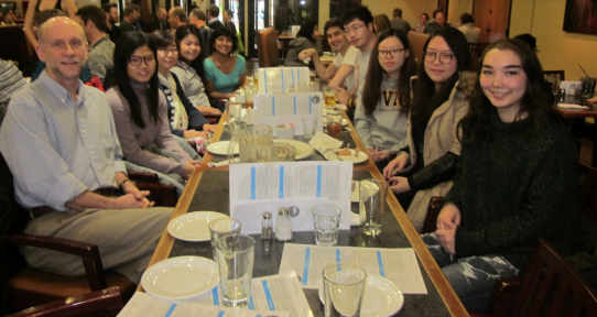 Prof. Tim Iles and undergraduate students celebrating the end of term at Grad House. Picture by Hiroko Noro.