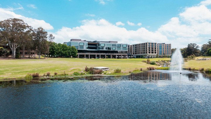 Maquarie University Central Courtyard Building with lake in foreground