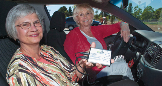 Two researchers in a car