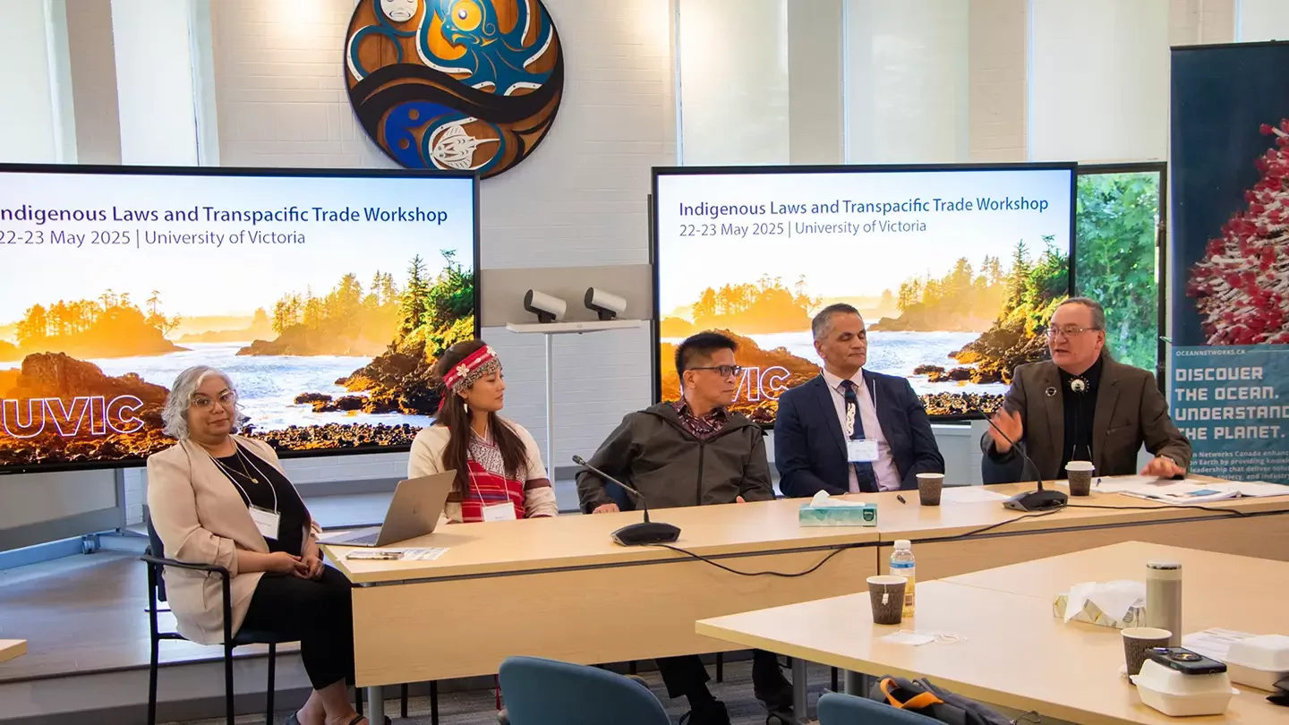 A panel of people speak.