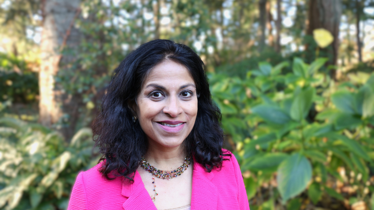Maneesha Deckha standing in the forest