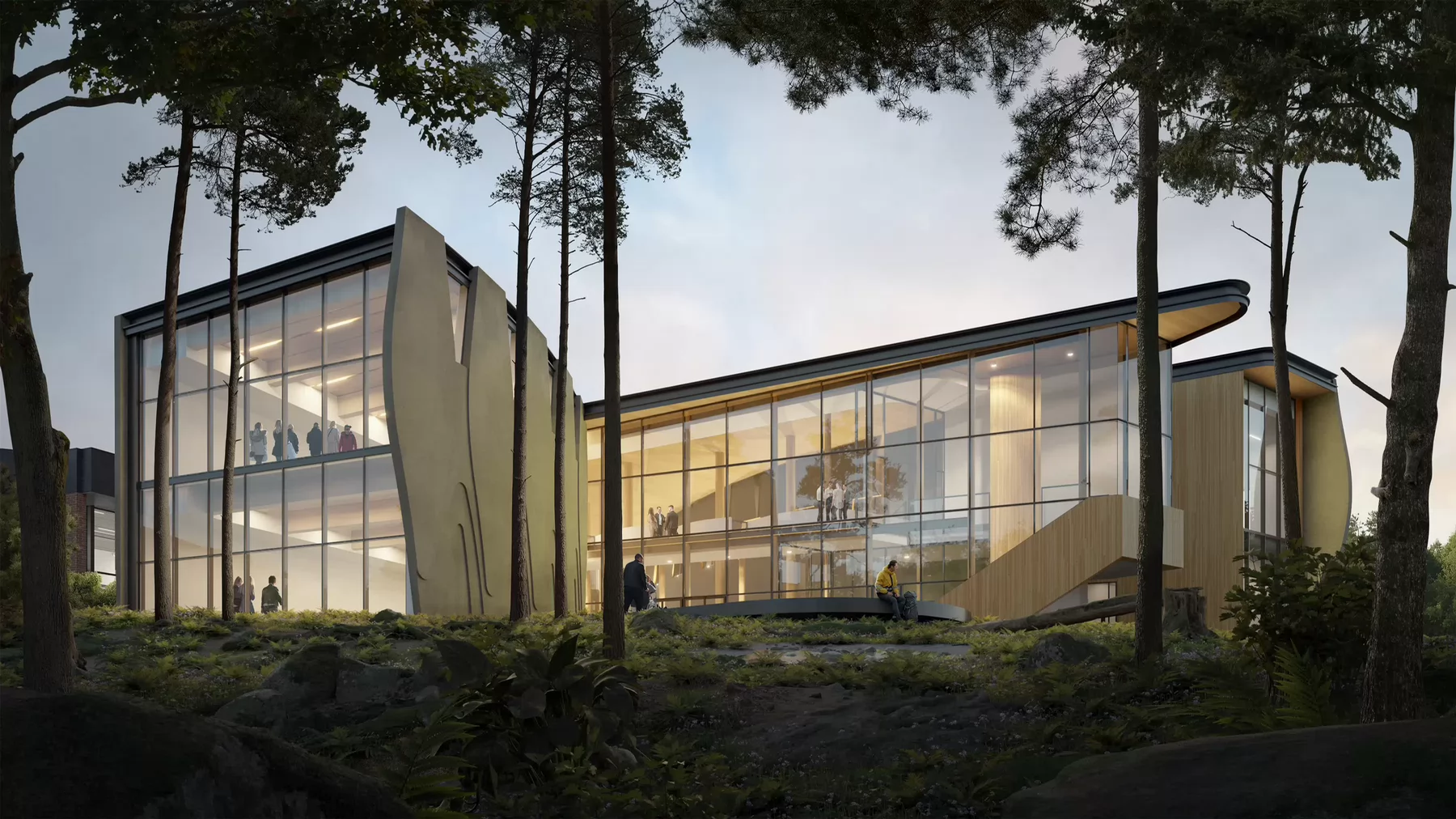 The back of the new Indigenous law wing amid forest.