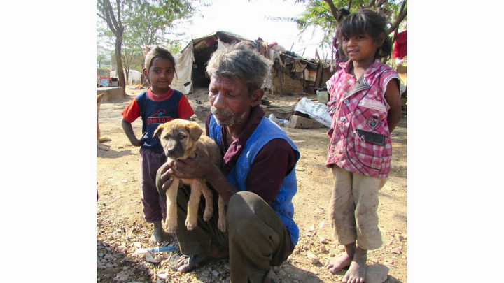 Indian family with street dog