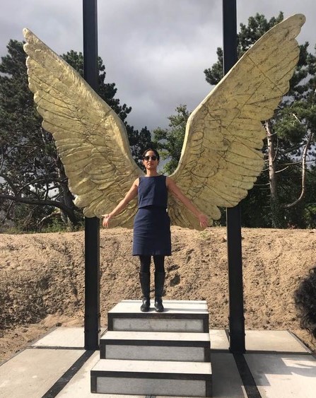 coop student standing in front of angel wings statue in the Netherlands