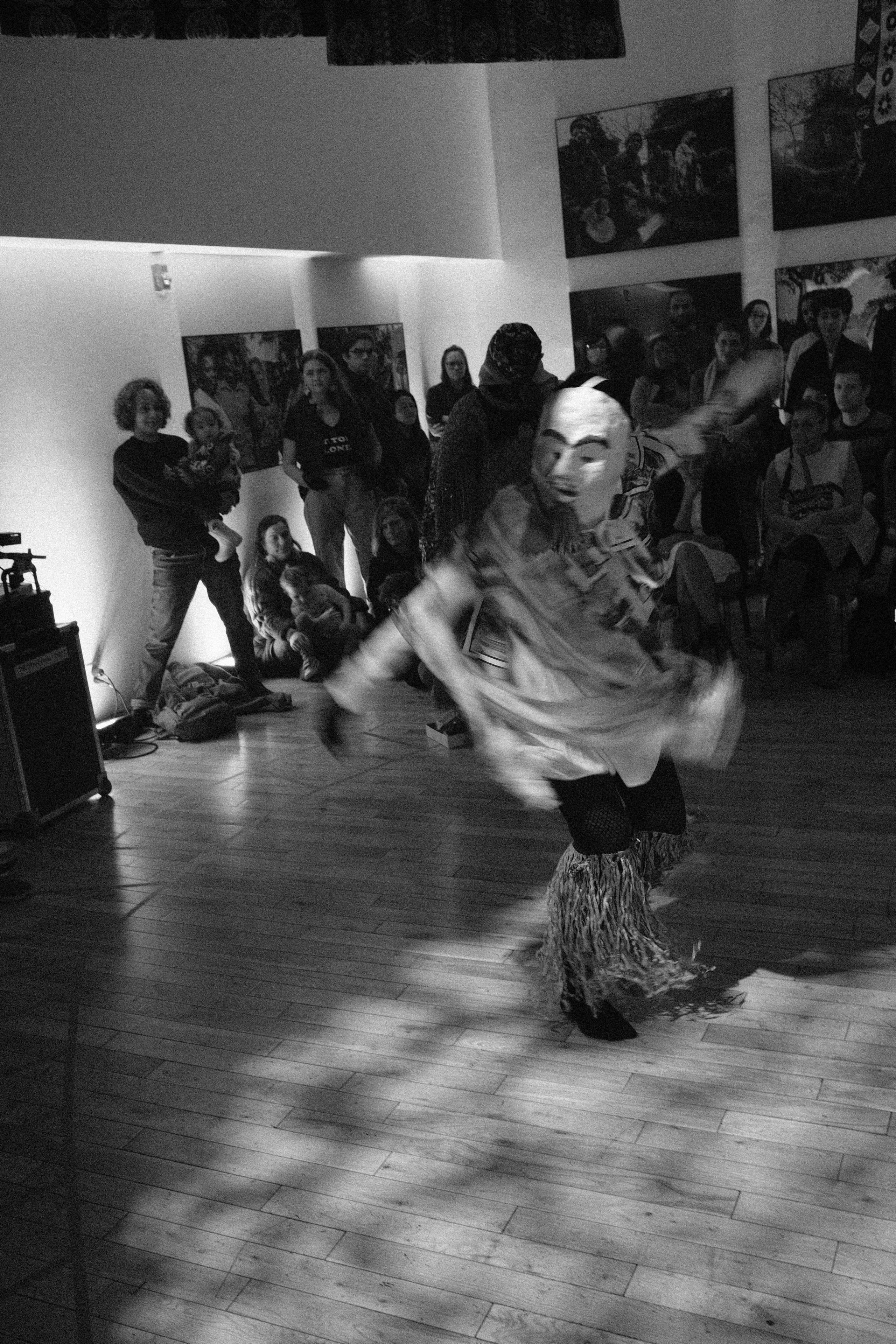 Masked dancer in motion