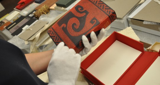 close-up of a student's hands unpacking art